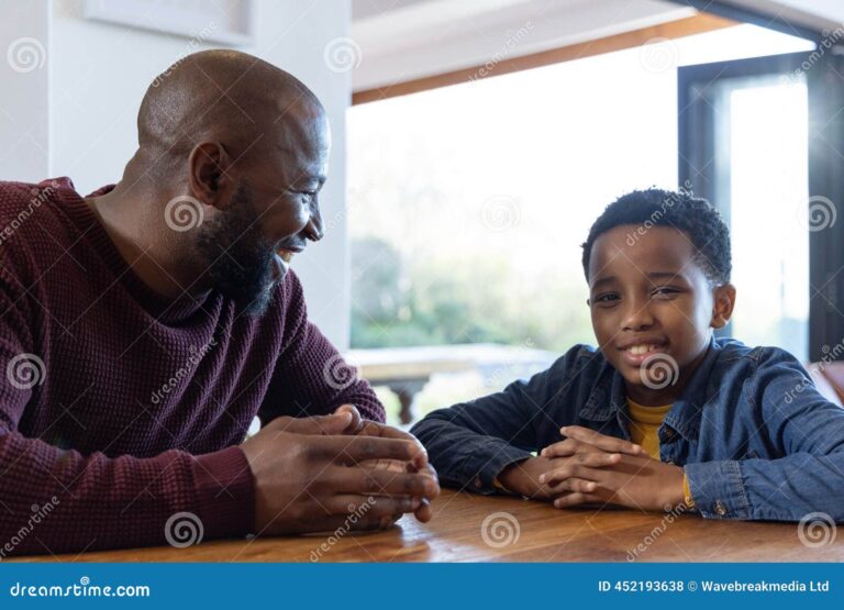 An African family — parent and child — talking together at home